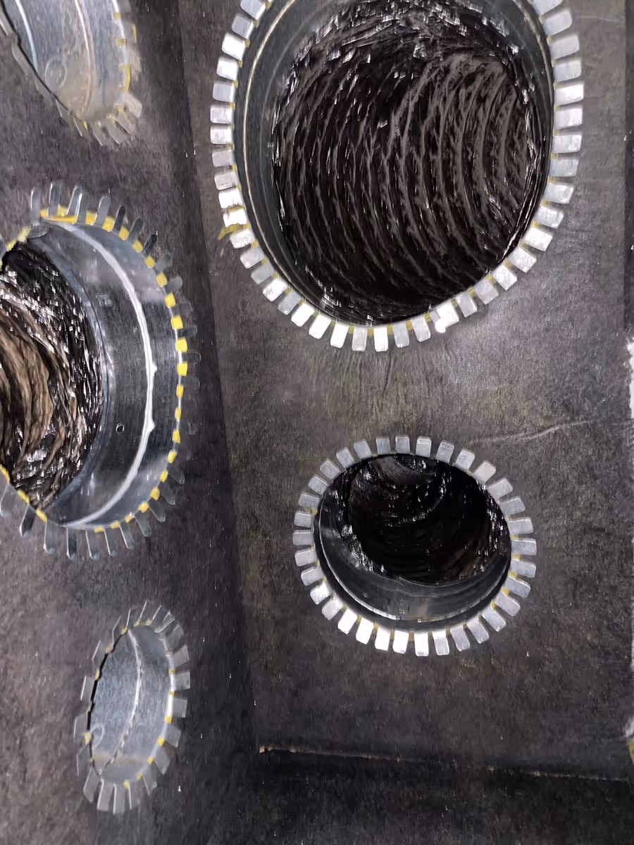 Dirty flex duct openings inside a return plenum on a South Florida air duct cleaning job