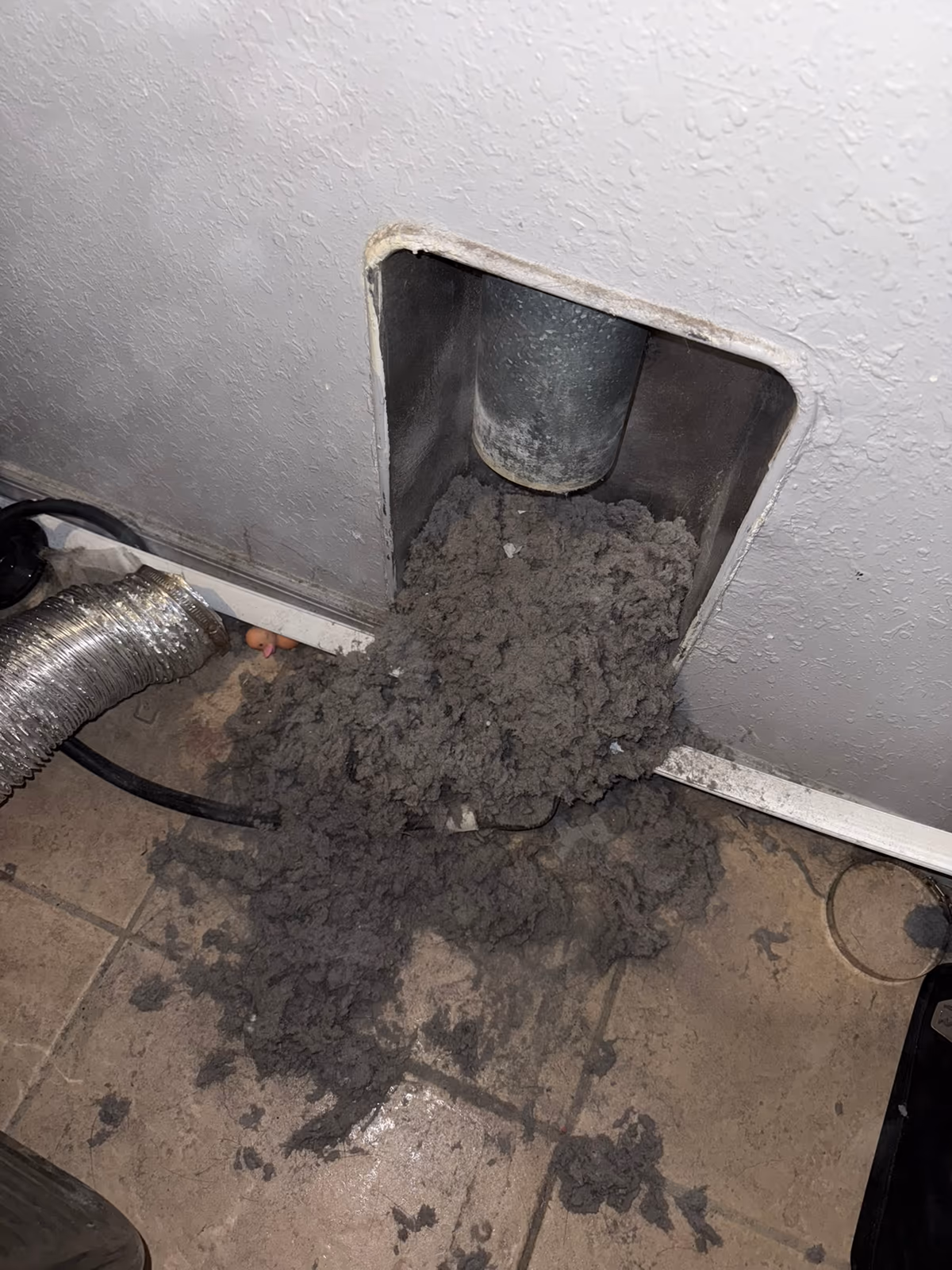 Lint pulled from a condo dryer vent line on a South Florida job