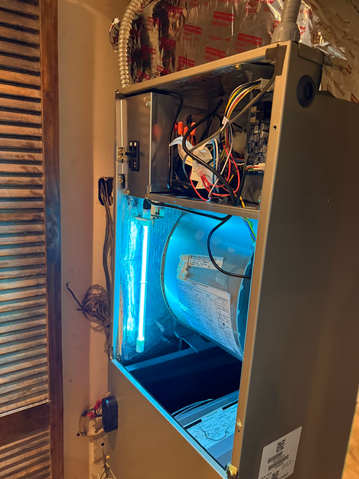 UV-C lamp running inside an air handler cabinet in a South Florida home